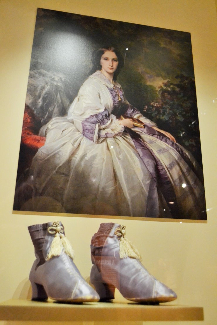 “Perkins purple,” the first synthetic dye, was discovered by British chemist William Henry Perkins by accident. Perkins was trying to find a cure for malaria. By 1858, this new “mauve” color became incredibly popular as it spread throughout the fashionably minded.  Shoes: French, c.1860 (Collection of the Bata Shoe Museum)  