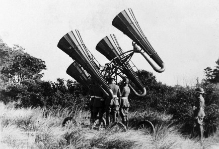American troops during World War I using an acoustic locator, mounted on a wheeled platform to monitor distant sounds (U.S. National Archives). 